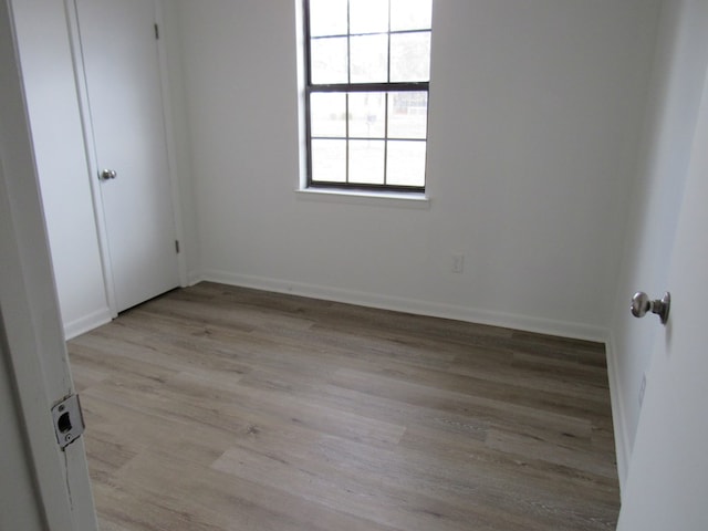 spare room with light hardwood / wood-style floors