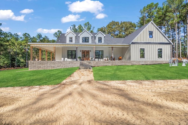 view of front of property with a porch and a front lawn