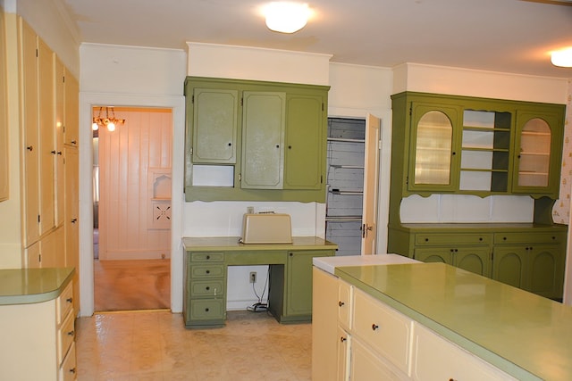 790 Claxton Ave, Elba, AL 36323 - kitchen featuring light countertops, green cabinetry, and an inviting chandelier