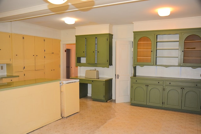 790 Claxton Ave, Elba, AL 36323 - kitchen featuring light countertops, green cabinets, and light floors
