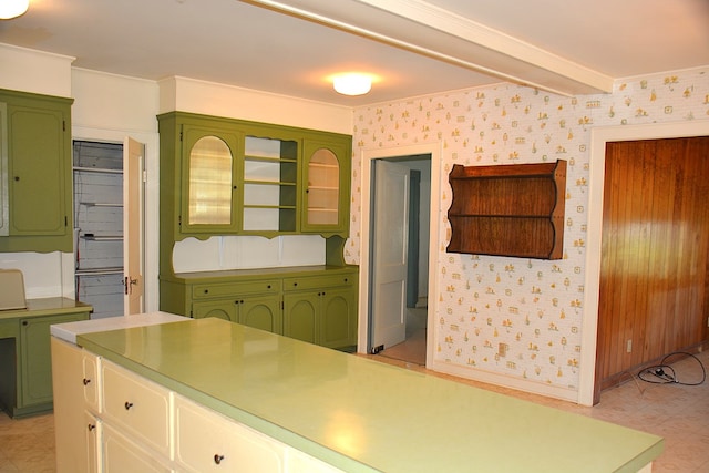 790 Claxton Ave, Elba, AL 36323 - kitchen with light countertops, wallpapered walls, baseboards, and green cabinetry
