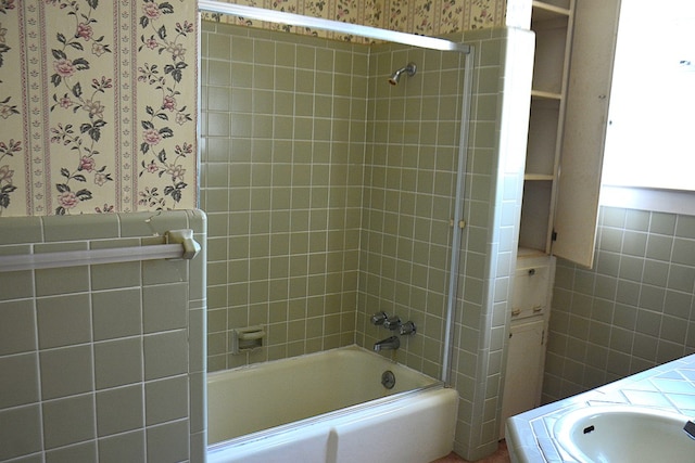 790 Claxton Ave, Elba, AL 36323 - full bath with tile walls, wallpapered walls, bathing tub / shower combination, and a sink
