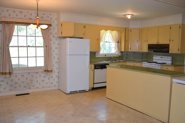 790 Claxton Ave, Elba, AL 36323 - kitchen with wallpapered walls, visible vents, under cabinet range hood, and white appliances