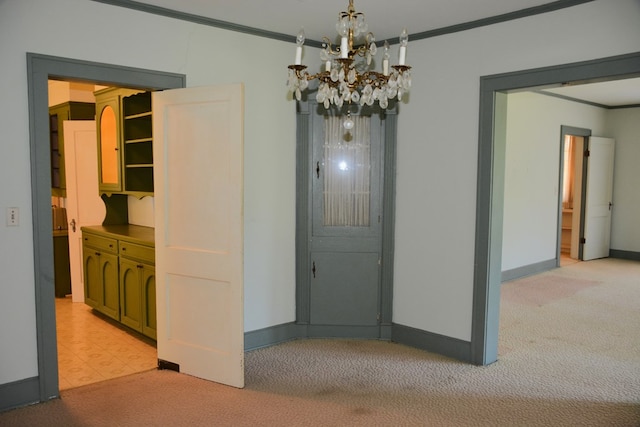 790 Claxton Ave, Elba, AL 36323 - unfurnished dining area with light colored carpet, baseboards, ornamental molding, and a notable chandelier