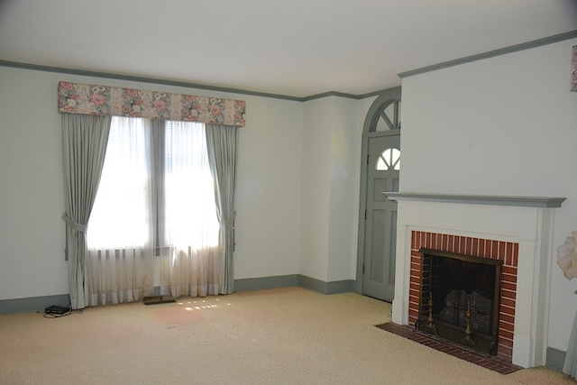 790 Claxton Ave, Elba, AL 36323 - unfurnished living room with a brick fireplace, carpet flooring, baseboards, and ornamental molding