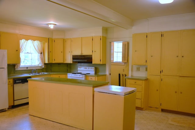 790 Claxton Ave, Elba, AL 36323 - kitchen featuring light floors, under cabinet range hood, white appliances, and a wealth of natural light
