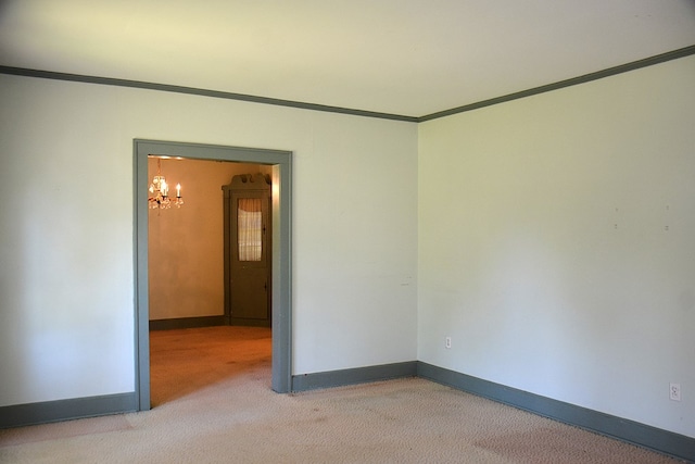 790 Claxton Ave, Elba, AL 36323 - carpeted empty room featuring baseboards, crown molding, and a chandelier