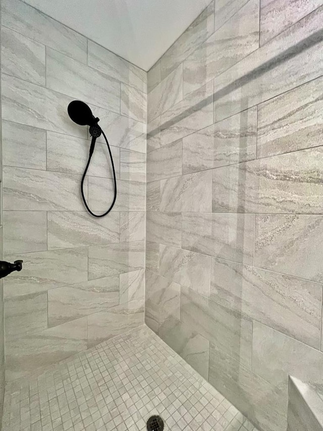 bathroom with a tile shower