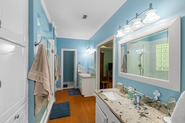 400 Bent Oak Dr, Dothan, AL 36303 - bathroom featuring a shower stall, vanity, ornamental molding, and wood finished floors