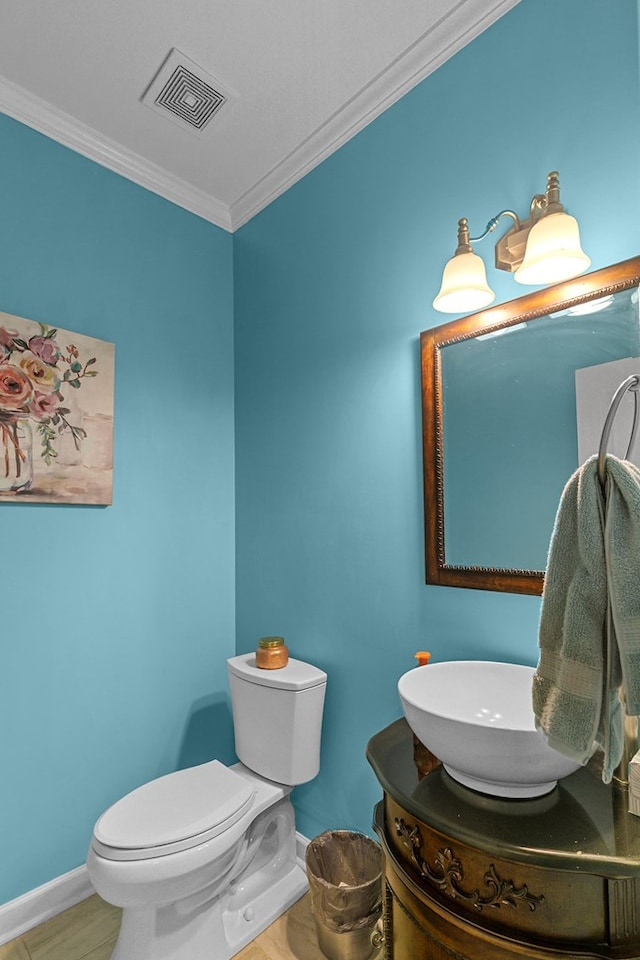 400 Bent Oak Dr, Dothan, AL 36303 - half bathroom with crown molding, vanity, and wood finished floors