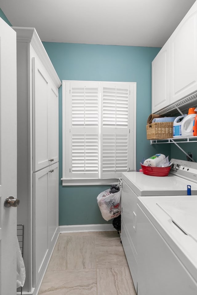 400 Bent Oak Dr, Dothan, AL 36303 - washroom with cabinet space, washer and dryer, and light marble finish floors