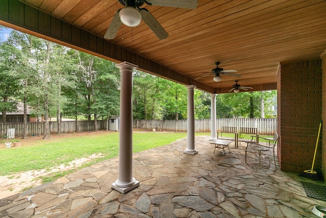 400 Bent Oak Dr, Dothan, AL 36303 - fenced backyard featuring a ceiling fan, a patio, and a storage unit
