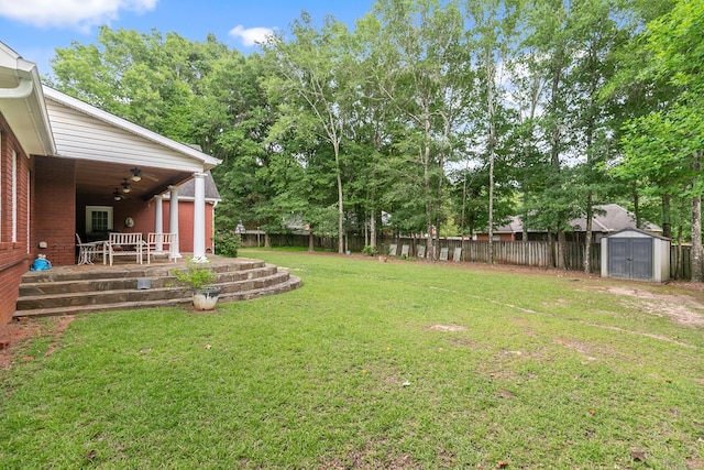 400 Bent Oak Dr, Dothan, AL 36303 - fenced backyard with a storage shed, ceiling fan, a patio, and view of wooded area