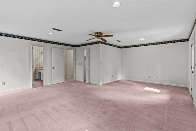 interior space featuring light colored carpet and ceiling fan