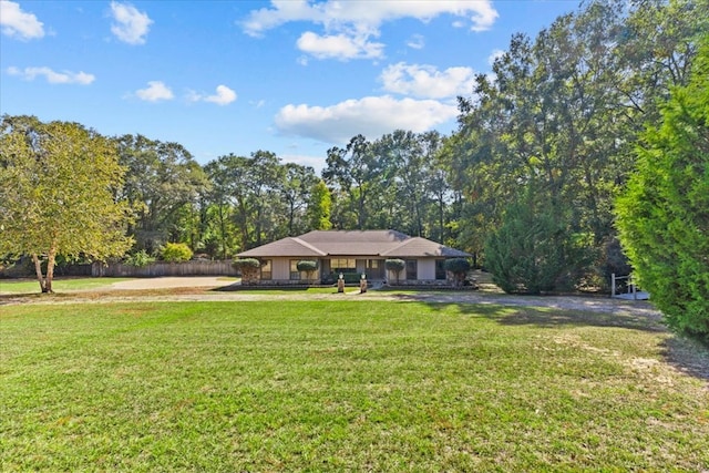 single story home with a front yard