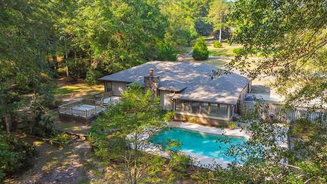 view of swimming pool with a sunroom