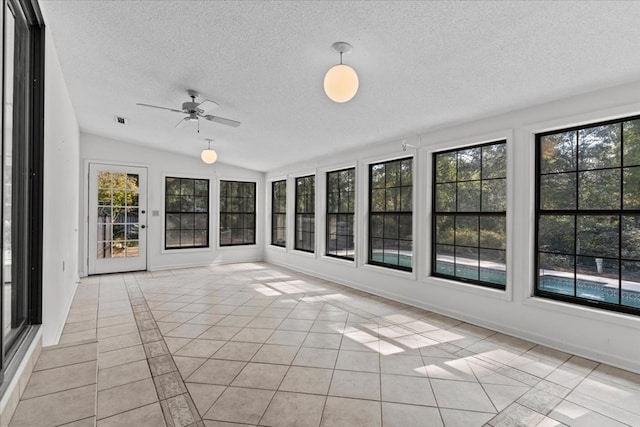 unfurnished sunroom with vaulted ceiling and ceiling fan