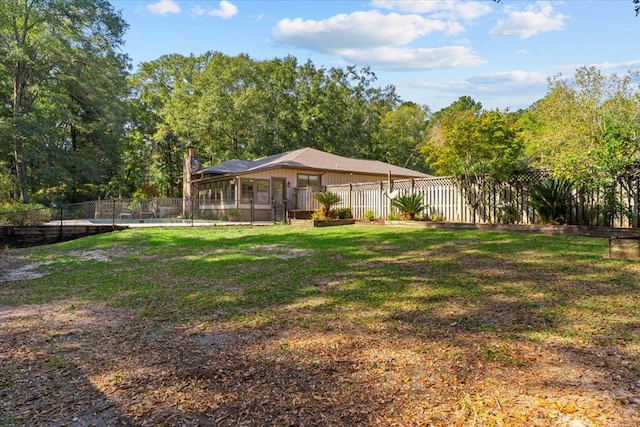 view of yard with a sunroom