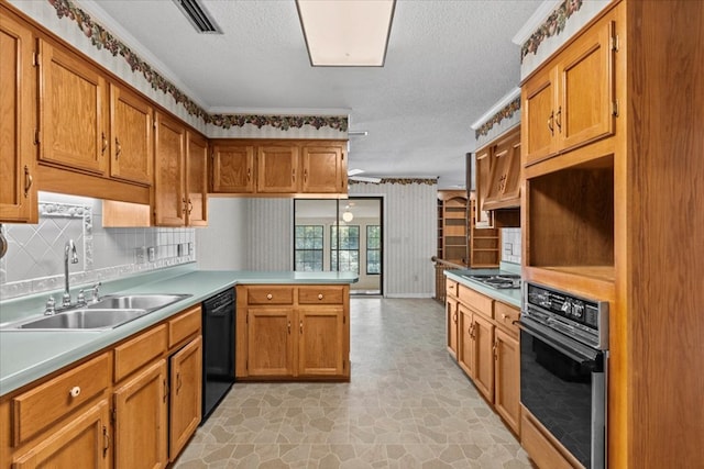 kitchen with black appliances, sink, ornamental molding, a textured ceiling, and kitchen peninsula