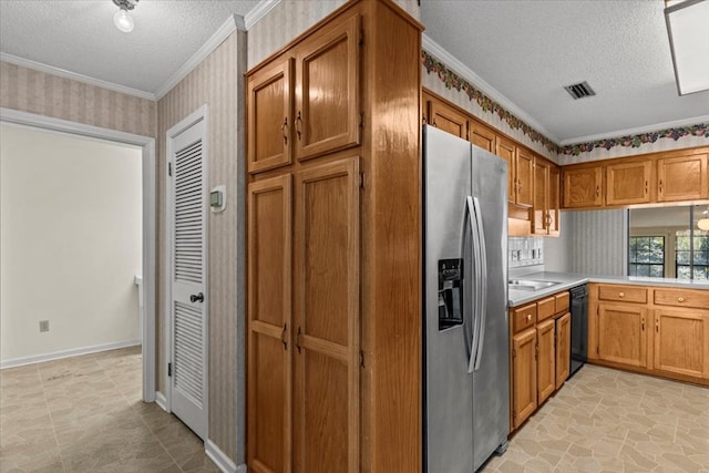 kitchen with stainless steel fridge, a textured ceiling, and ornamental molding