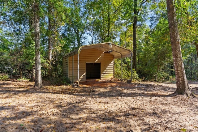 view of outbuilding with a carport