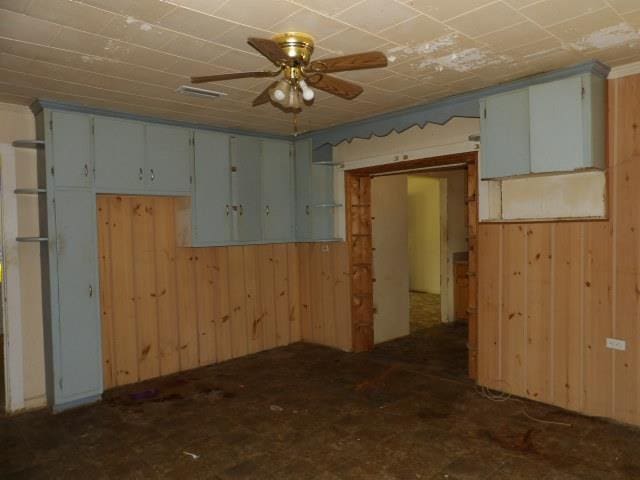 1011 Sunset Blvd, Elba, AL 36323 - empty room featuring ceiling fan and wood walls