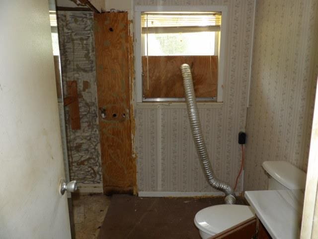 1011 Sunset Blvd, Elba, AL 36323 - bathroom featuring toilet and baseboards
