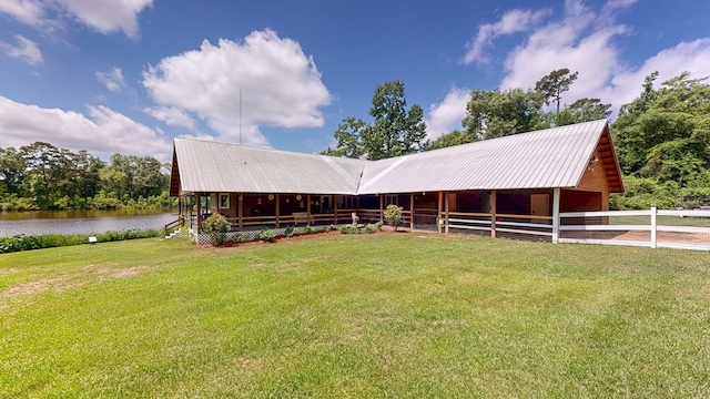8875 E State Highway 52, Webb, AL 36376 - view of front of property featuring a water view, metal roof, and a garage