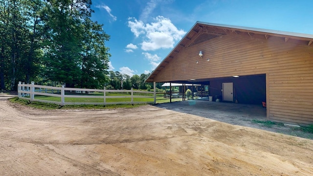 8875 E State Highway 52, Webb, AL 36376 - view of side of home with driveway, an exterior structure, an outbuilding, and a carport