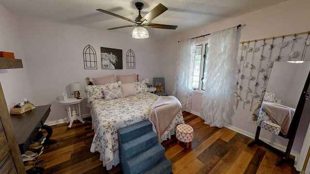 8875 E State Highway 52, Webb, AL 36376 - bedroom featuring wood finished floors, a ceiling fan, and baseboards