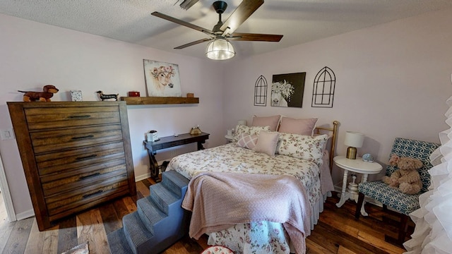 8875 E State Highway 52, Webb, AL 36376 - bedroom featuring hardwood / wood-style floors, a ceiling fan, and baseboards