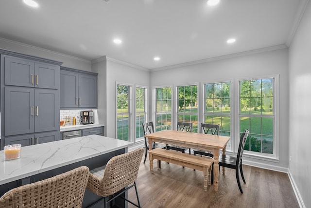 856 S County Rd 49, Dothan, AL 36301 - dining room featuring wet bar, dark wood-type flooring, baseboards, recessed lighting, and ornamental molding