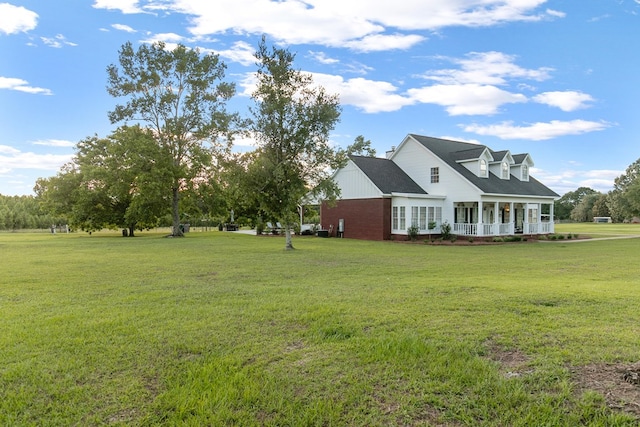 856 S County Rd 49, Dothan, AL 36301 - view of front facade with covered porch, a front yard, and brick siding