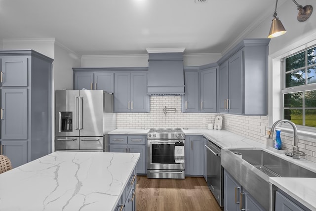 856 S County Rd 49, Dothan, AL 36301 - kitchen featuring stainless steel appliances, a sink, gray cabinets, light stone counters, and crown molding