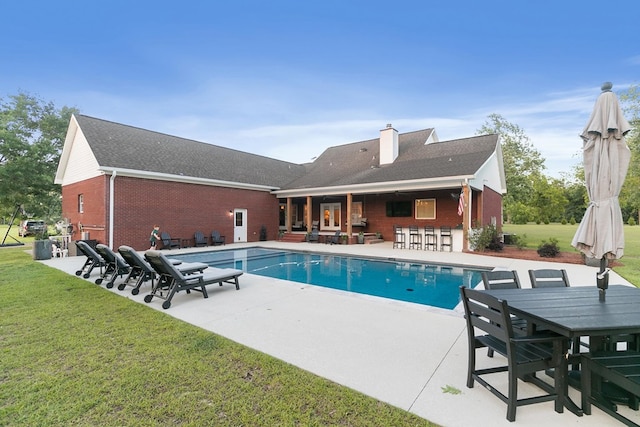 856 S County Rd 49, Dothan, AL 36301 - swimming pool featuring a patio area, a lawn, and outdoor dining space