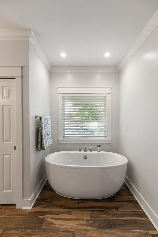 856 S County Rd 49, Dothan, AL 36301 - full bathroom with a freestanding tub, wood finished floors, baseboards, and crown molding