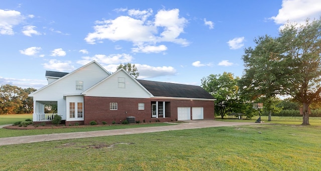 856 S County Rd 49, Dothan, AL 36301 - view of side of property featuring an attached garage, driveway, a yard, and brick siding