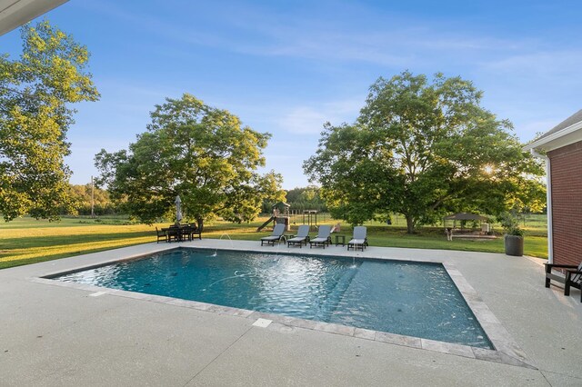 856 S County Rd 49, Dothan, AL 36301 - outdoor pool featuring a lawn and a patio area
