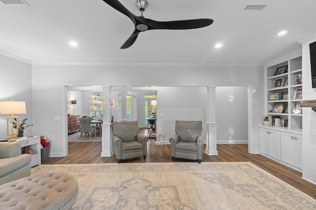 856 S County Rd 49, Dothan, AL 36301 - living area with ceiling fan, wood finished floors, crown molding, recessed lighting, and decorative columns