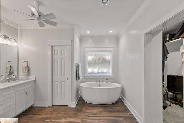 856 S County Rd 49, Dothan, AL 36301 - full bathroom featuring wood finished floors, ornamental molding, a closet, a soaking tub, and vanity