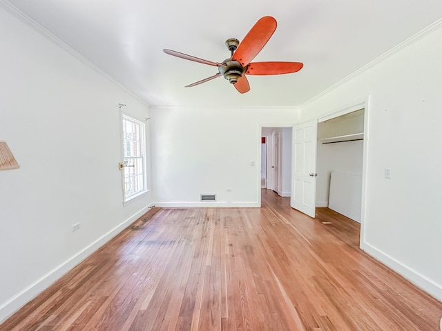800 W Brookside Ave, Geneva, AL 36340 - unfurnished bedroom featuring ornamental molding, light wood-type flooring, and ceiling fan