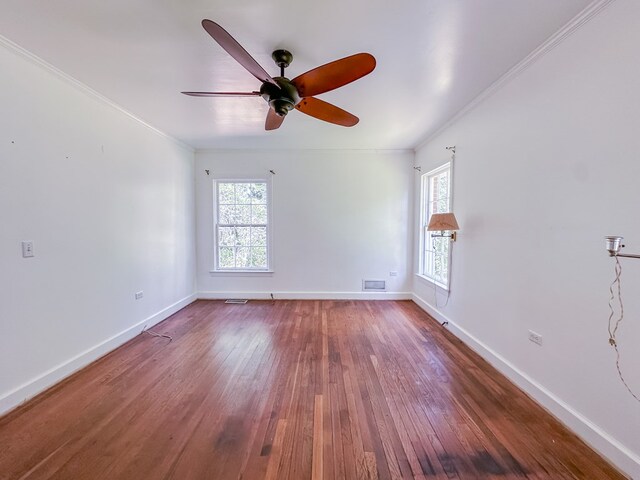800 W Brookside Ave, Geneva, AL 36340 - empty room featuring ornamental molding, wood finished floors, and a ceiling fan