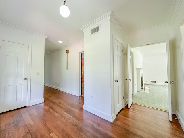 800 W Brookside Ave, Geneva, AL 36340 - unfurnished room featuring wood finished floors, crown molding, and a fireplace
