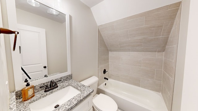 full bathroom with vanity, tiled shower / bath combo, and toilet