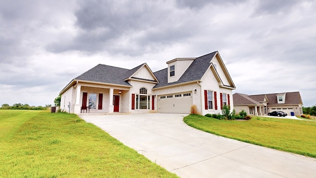 view of front of home featuring central AC unit, a porch, a garage, and a front yard