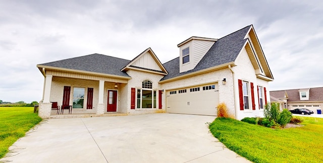 view of front of property with a front lawn, a porch, and a garage