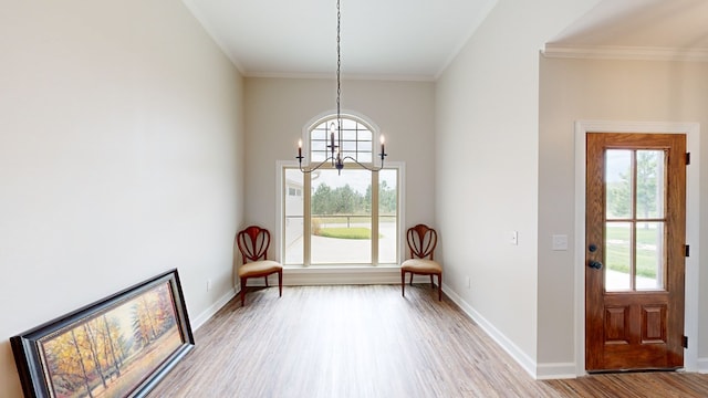 unfurnished room with an inviting chandelier, light hardwood / wood-style flooring, and plenty of natural light