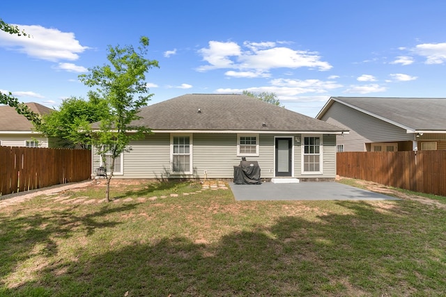 404 Powder Horn Dr, Midland City, AL 36350 - rear view of property with a fenced backyard, roof with shingles, a patio area, and a lawn