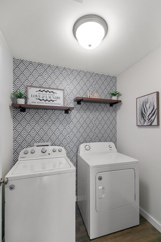 404 Powder Horn Dr, Midland City, AL 36350 - washroom featuring dark wood finished floors, washing machine and dryer, an accent wall, and laundry area