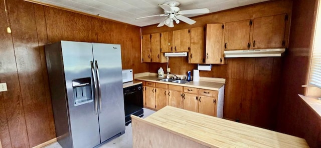 kitchen featuring a ceiling fan, white microwave, stainless steel fridge with ice dispenser, under cabinet range hood, and brown cabinets